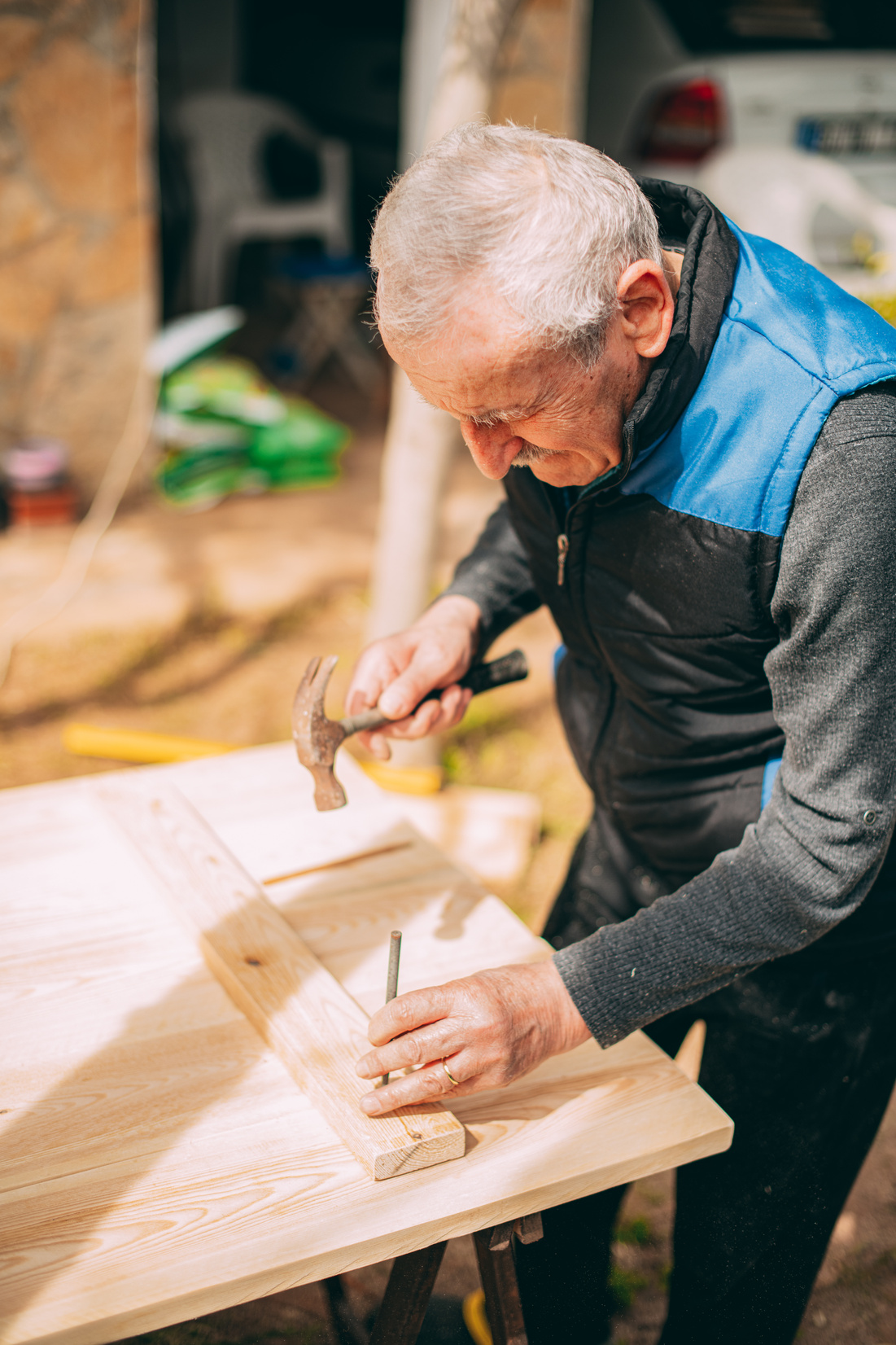 Old Man Making DIY Wooden Table