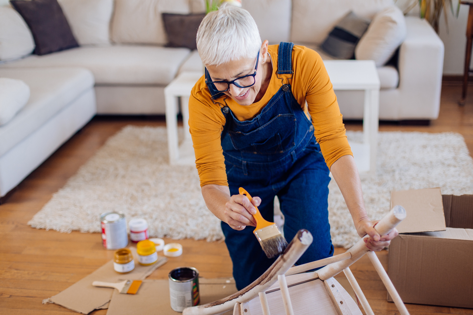 Mature woman enjoying during DIY work at home