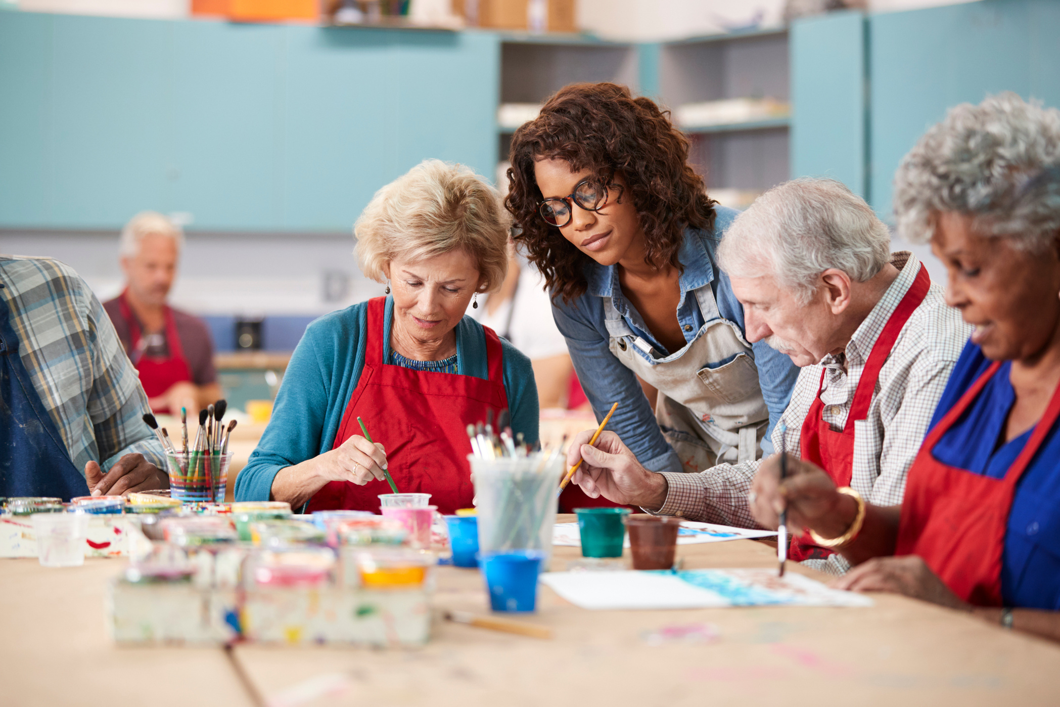 Group of Retired Seniors Attending Art Class in Community Centre